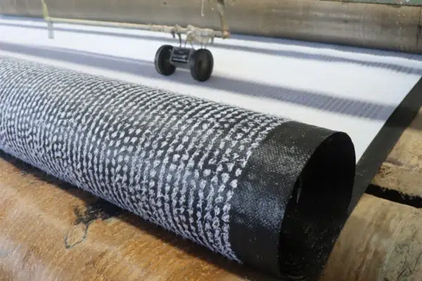 Geosynthetic clay liner roll showing layered material